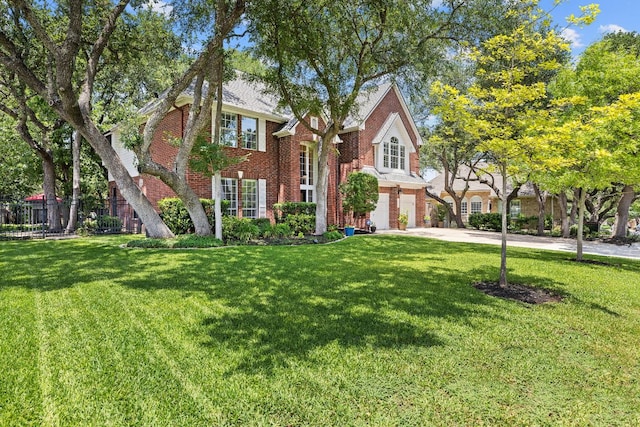 3808 Royal Troon Dr, Round Rock, TX 78664 - view of front of property featuring a garage, driveway, brick siding, and a front yard