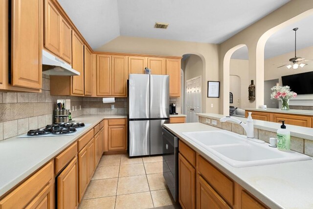 10609 Thoroughbred Dr, Austin, TX 78748 - kitchen with freestanding refrigerator, under cabinet range hood, white gas stovetop, dishwasher, and a sink