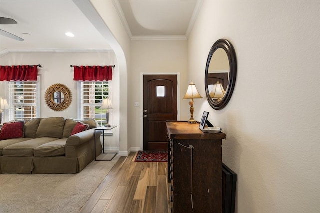 1049 Naranjo Dr, Georgetown, TX 78628 - entrance foyer featuring wood finished floors, baseboards, crown molding, and ceiling fan