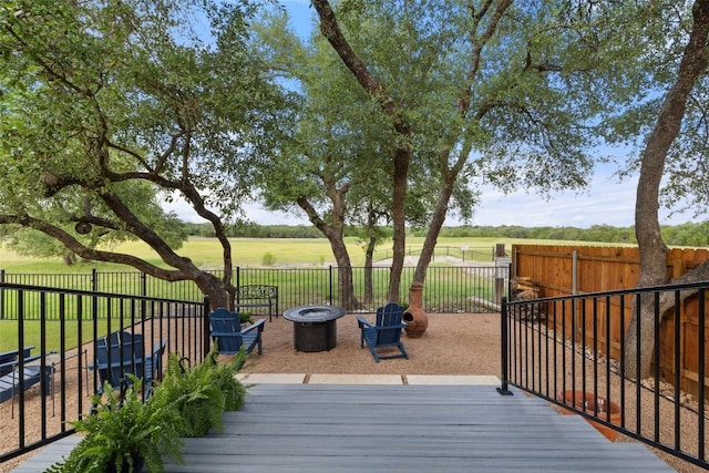 1049 Naranjo Dr, Georgetown, TX 78628 - wooden terrace featuring an outdoor fire pit and a fenced backyard