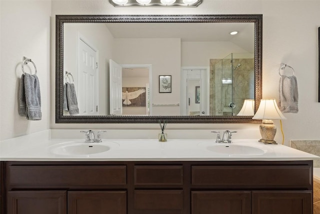 1049 Naranjo Dr, Georgetown, TX 78628 - bathroom with a shower stall and double vanity