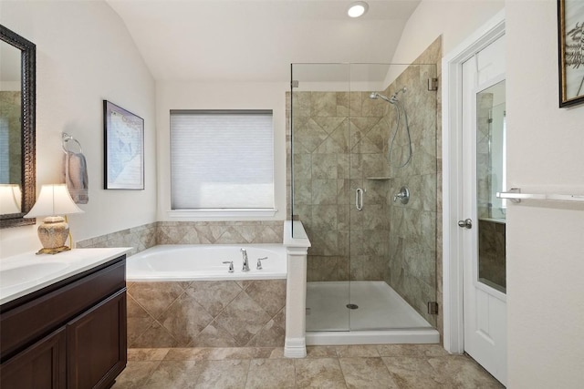 1049 Naranjo Dr, Georgetown, TX 78628 - full bath with a bath, vanity, a shower stall, lofted ceiling, and tile patterned flooring