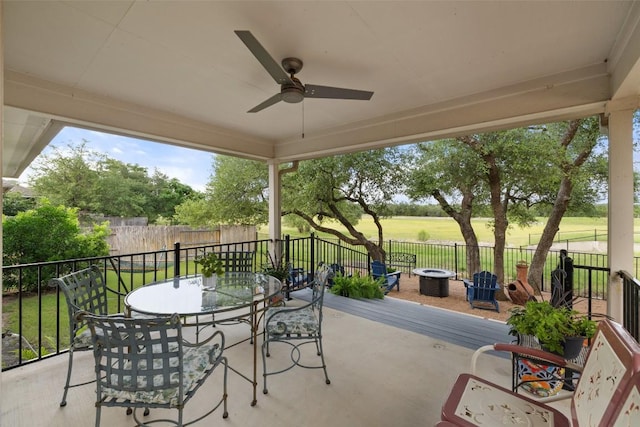 1049 Naranjo Dr, Georgetown, TX 78628 - view of patio with an outdoor fire pit, outdoor dining area, and a ceiling fan