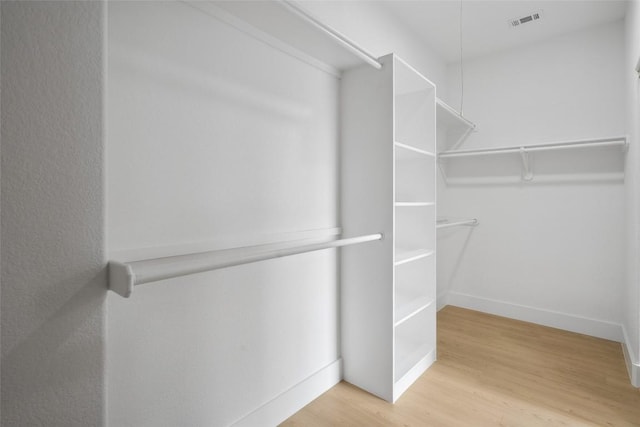 14904 Cordero Dr, Austin, TX 78717 - walk in closet with wood finished floors
