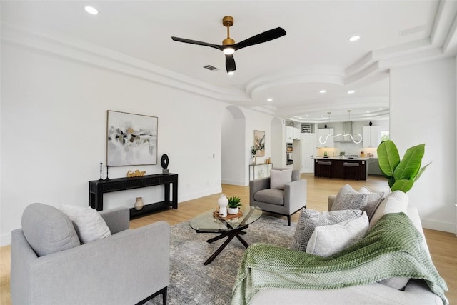 14904 Cordero Dr, Austin, TX 78717 - living area featuring arched walkways, ceiling fan, recessed lighting, light wood-style floors, and baseboards