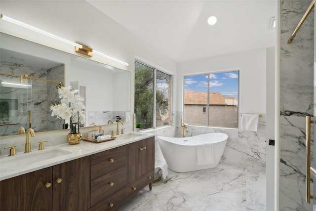 14904 Cordero Dr, Austin, TX 78717 - bathroom featuring a wainscoted wall, a marble finish shower, double vanity, a soaking tub, and marble tiled flooring