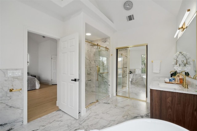14904 Cordero Dr, Austin, TX 78717 - ensuite bathroom with vanity, a marble finish shower, a freestanding tub, and marble tiled flooring