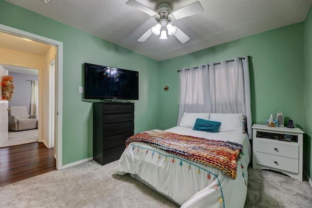 1600 Hatch Rd, Cedar Park, TX 78613 - bedroom featuring carpet, a textured ceiling, a ceiling fan, and baseboards