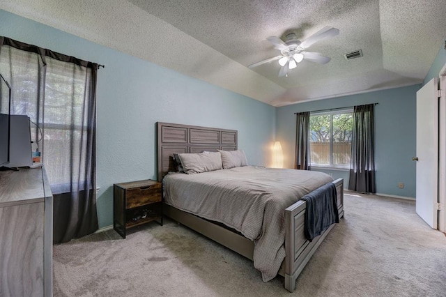 1600 Hatch Rd, Cedar Park, TX 78613 - bedroom with carpet floors, a textured ceiling, baseboards, ceiling fan, and a tray ceiling