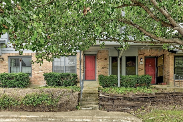 1411 Gracy Farms Ln Unit 69, Austin, TX 78758 - view of front facade featuring brick siding