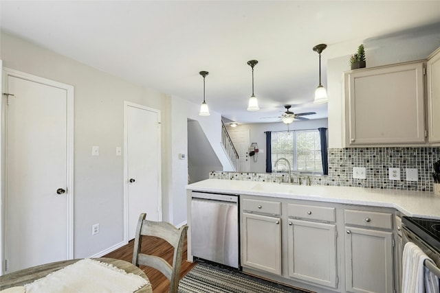 1411 Gracy Farms Ln Unit 69, Austin, TX 78758 - kitchen with dishwasher, a sink, ceiling fan, a peninsula, and dark wood-type flooring