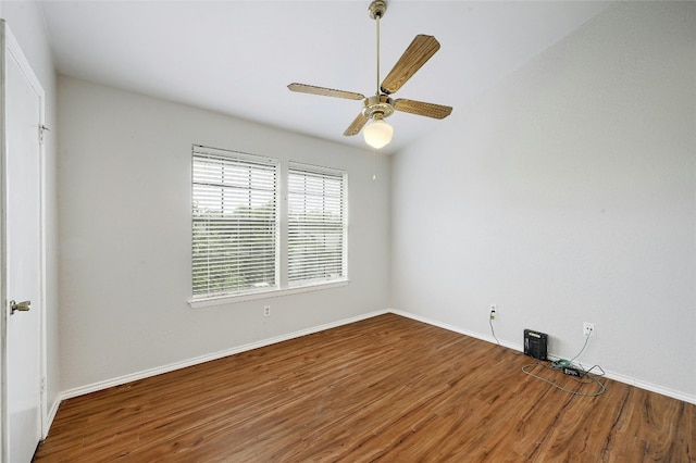 1411 Gracy Farms Ln Unit 69, Austin, TX 78758 - empty room with wood finished floors, baseboards, and ceiling fan