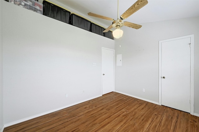 1411 Gracy Farms Ln Unit 69, Austin, TX 78758 - unfurnished bedroom featuring wood finished floors, baseboards, and ceiling fan