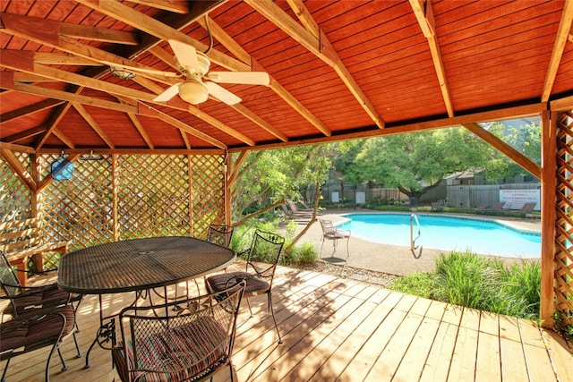 1411 Gracy Farms Ln Unit 69, Austin, TX 78758 - view of pool with a wooden deck, a fenced backyard, outdoor dining area, and a ceiling fan