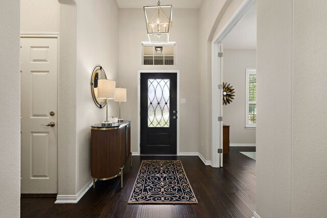 116 Belford St, Georgetown, TX 78628 - foyer entrance featuring dark wood-style floors, baseboards, and a chandelier