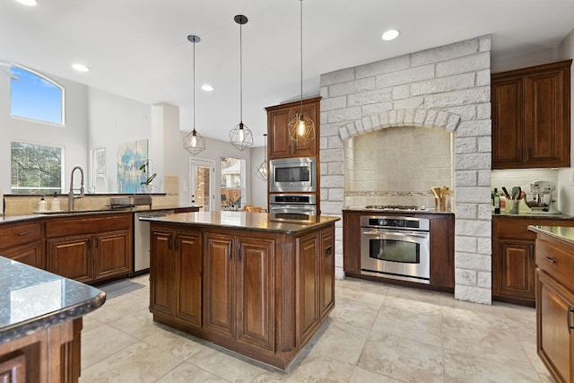 370 Ledge Stone Dr, Austin, TX 78737 - kitchen with stainless steel appliances, a sink, healthy amount of natural light, backsplash, and recessed lighting