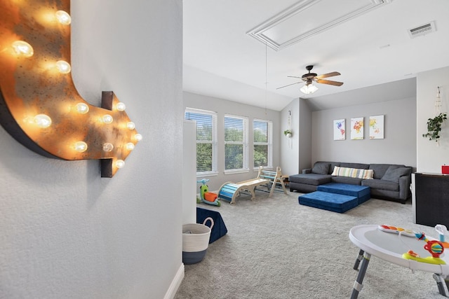 370 Ledge Stone Dr, Austin, TX 78737 - living room with attic access, carpet flooring, baseboards, and a ceiling fan