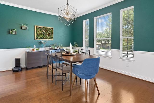 370 Ledge Stone Dr, Austin, TX 78737 - dining room with plenty of natural light, a chandelier, wood finished floors, ornamental molding, and baseboards