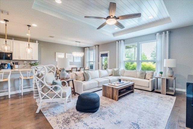 610 Ridge Park Dr, New Braunfels, TX 78130 - living area with a raised ceiling, dark wood-type flooring, recessed lighting, ceiling fan, and baseboards