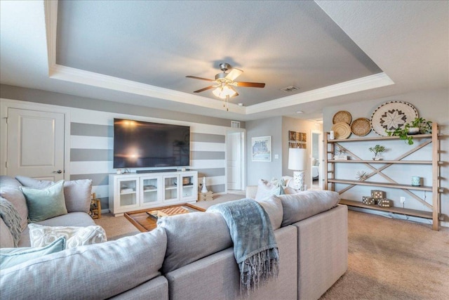 610 Ridge Park Dr, New Braunfels, TX 78130 - living area featuring a tray ceiling, ceiling fan, carpet, and ornamental molding