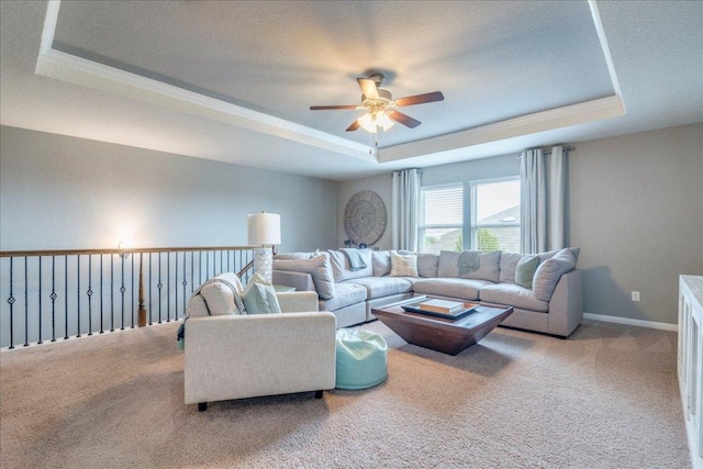 610 Ridge Park Dr, New Braunfels, TX 78130 - carpeted living area with a tray ceiling and a ceiling fan