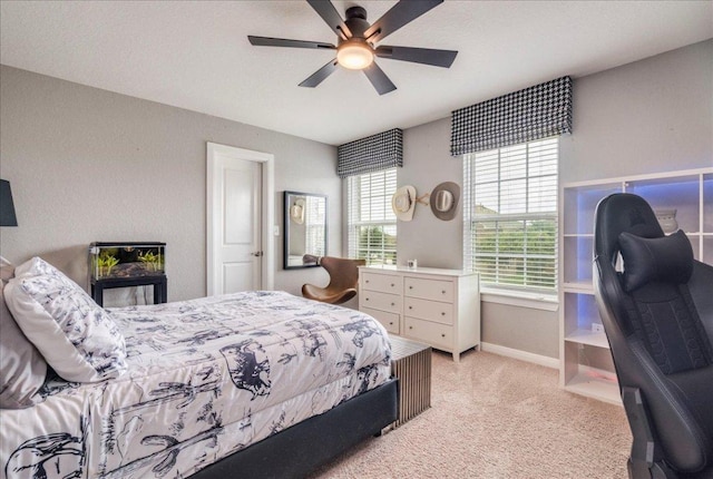 610 Ridge Park Dr, New Braunfels, TX 78130 - bedroom featuring light carpet, baseboards, and a ceiling fan