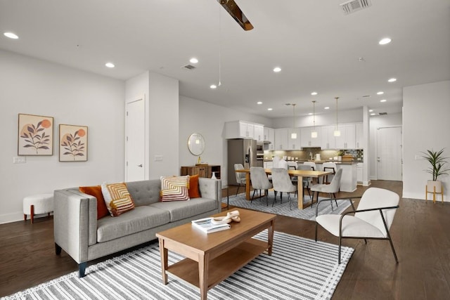 2116 Philomena St, Austin, TX 78723 - living area featuring wood finished floors, recessed lighting, and baseboards