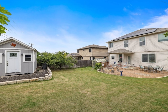 326 Comal Run, Hutto, TX 78634 - fenced backyard featuring a storage shed and a patio