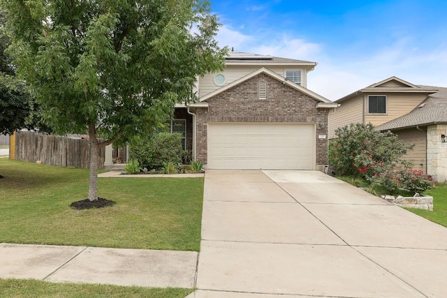 326 Comal Run, Hutto, TX 78634 - view of front of house with solar panels, brick siding, a garage, and concrete driveway