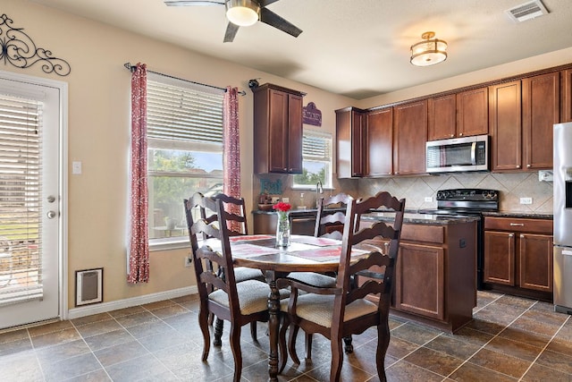 326 Comal Run, Hutto, TX 78634 - dining room featuring ceiling fan and baseboards
