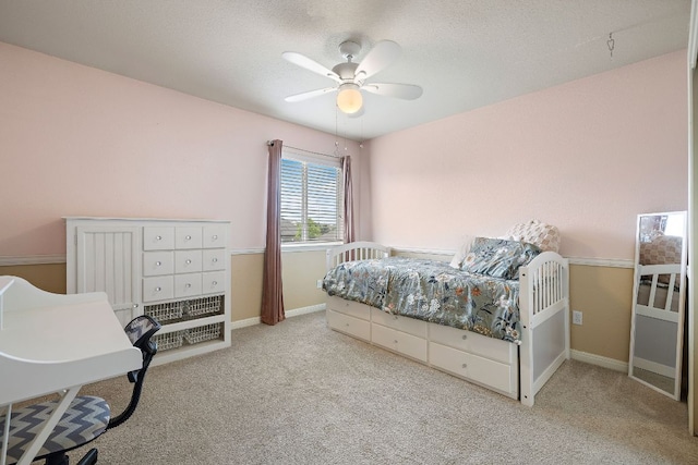 326 Comal Run, Hutto, TX 78634 - bedroom with carpet, ceiling fan, and a textured ceiling