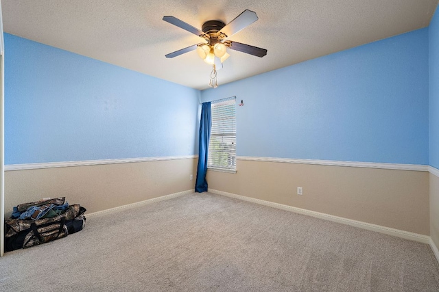 326 Comal Run, Hutto, TX 78634 - empty room featuring carpet floors, ceiling fan, and a textured ceiling