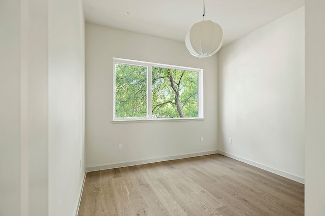 2405 E 22nd St, Austin, TX 78722 - unfurnished room featuring wood finished floors and baseboards