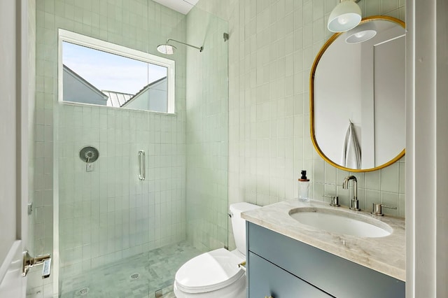 2405 E 22nd St, Austin, TX 78722 - bathroom with tile walls, a stall shower, vanity, toilet, and tasteful backsplash