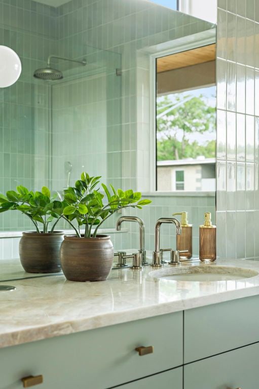 2405 E 22nd St, Austin, TX 78722 - bathroom with vanity and tasteful backsplash