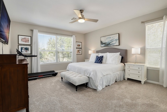 7221 Seneca Falls Loop, Austin, TX 78739 - bedroom with light carpet, baseboards, and a ceiling fan