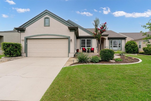 109 Timber Hitch Ct, Georgetown, TX 78633 - view of front of home featuring stucco siding, a front lawn, driveway, and a garage