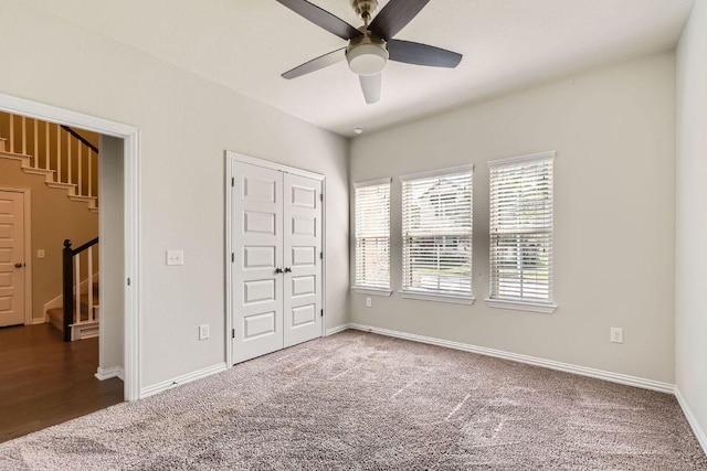 8817 Slater Dr, Austin, TX 78747 - unfurnished bedroom featuring carpet flooring, baseboards, and ceiling fan