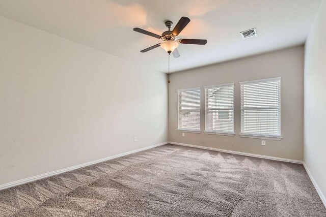 8817 Slater Dr, Austin, TX 78747 - spare room with carpet, ceiling fan, and baseboards