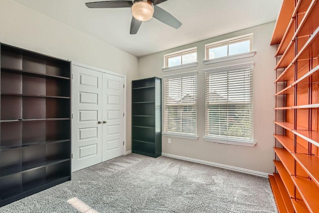 8817 Slater Dr, Austin, TX 78747 - unfurnished bedroom featuring carpet floors, a closet, baseboards, and ceiling fan