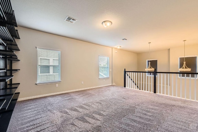 8817 Slater Dr, Austin, TX 78747 - carpeted empty room with baseboards