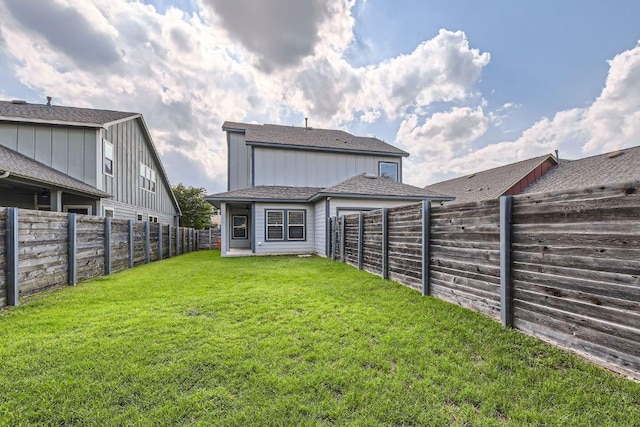 8817 Slater Dr, Austin, TX 78747 - rear view of property featuring board and batten siding