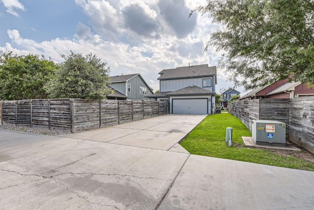 8817 Slater Dr, Austin, TX 78747 - view of front of home featuring concrete driveway and a garage