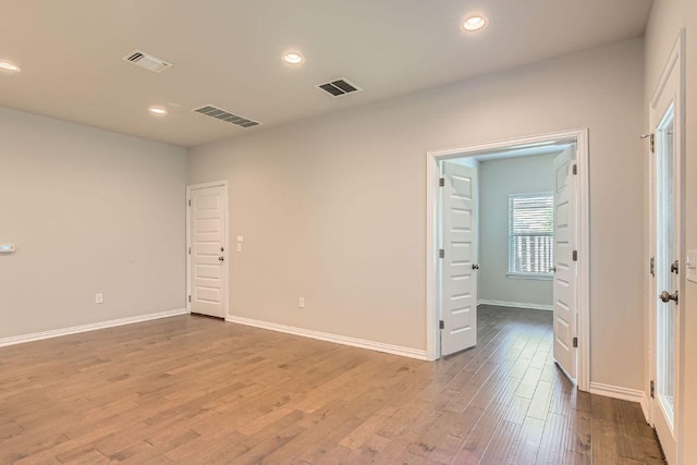 8817 Slater Dr, Austin, TX 78747 - unfurnished room featuring wood finished floors, recessed lighting, and baseboards