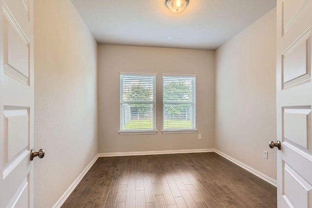 8817 Slater Dr, Austin, TX 78747 - spare room with dark wood-style flooring and baseboards