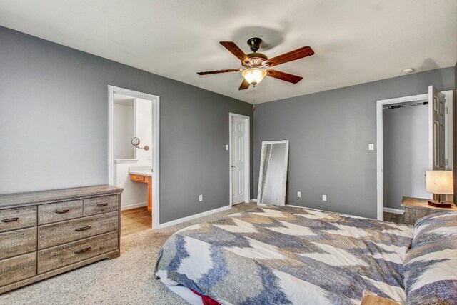 1032 Stacias Way, Pflugerville, TX 78660 - bedroom with light colored carpet, a ceiling fan, ensuite bathroom, and baseboards