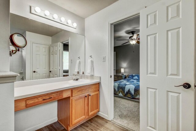 1032 Stacias Way, Pflugerville, TX 78660 - ensuite bathroom featuring ceiling fan, wood finished floors, and vanity