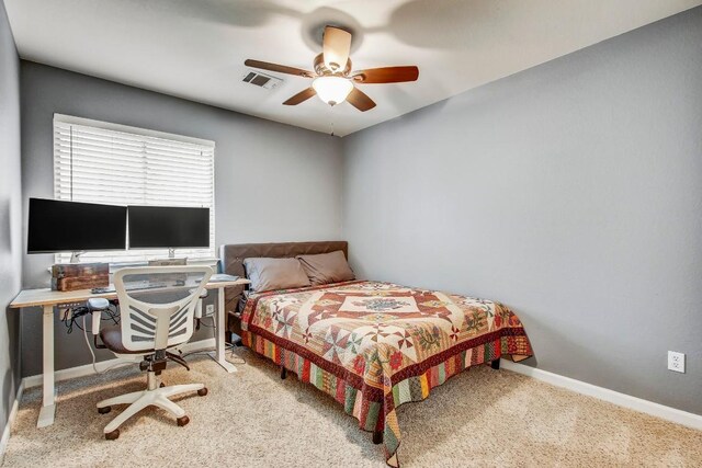 1032 Stacias Way, Pflugerville, TX 78660 - carpeted bedroom featuring baseboards and ceiling fan