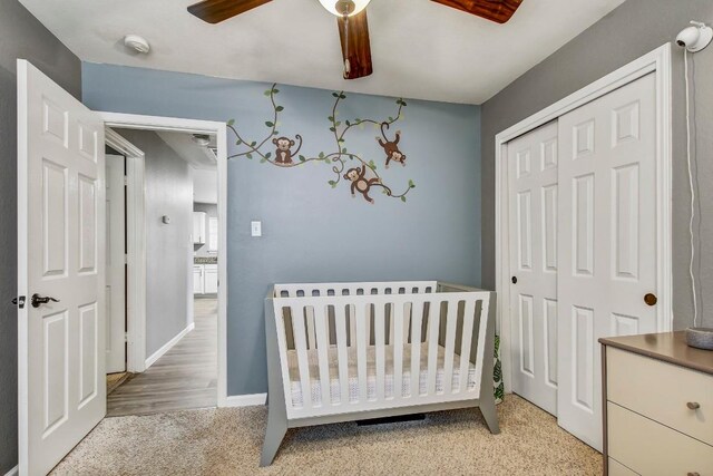 1032 Stacias Way, Pflugerville, TX 78660 - bedroom featuring a closet, a nursery area, ceiling fan, and baseboards