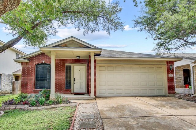 1032 Stacias Way, Pflugerville, TX 78660 - single story home with a garage, driveway, and brick siding